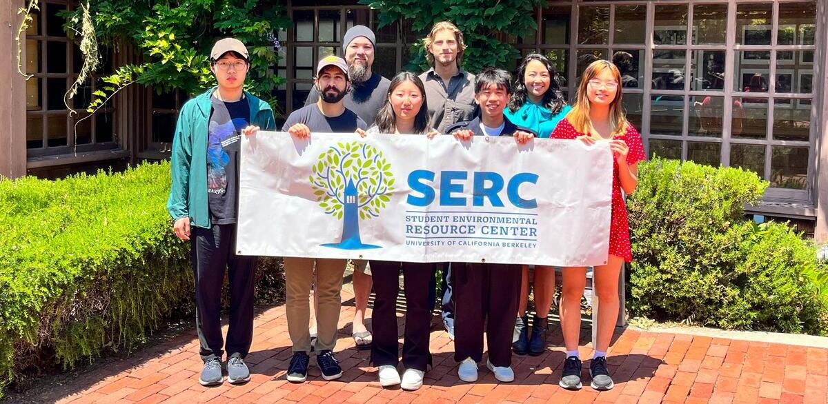 Science Scholars holding the SERC banner