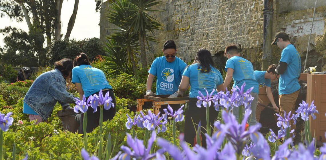 Volunteers gardening for GRID Alternatives