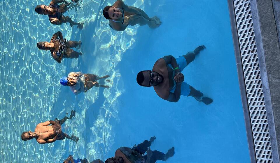 Swim students in a pool