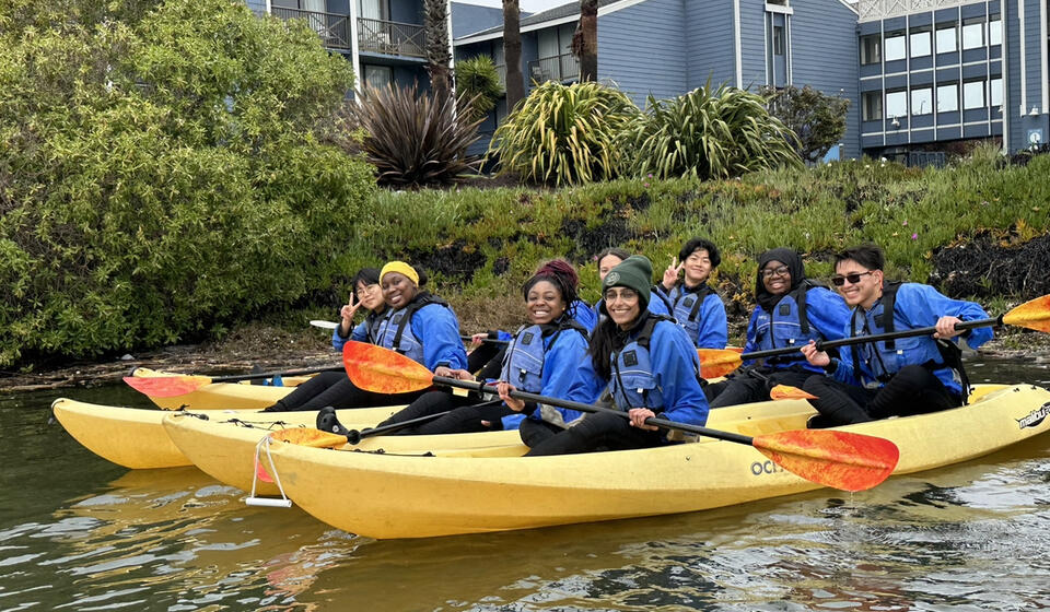 Students in water kayaking