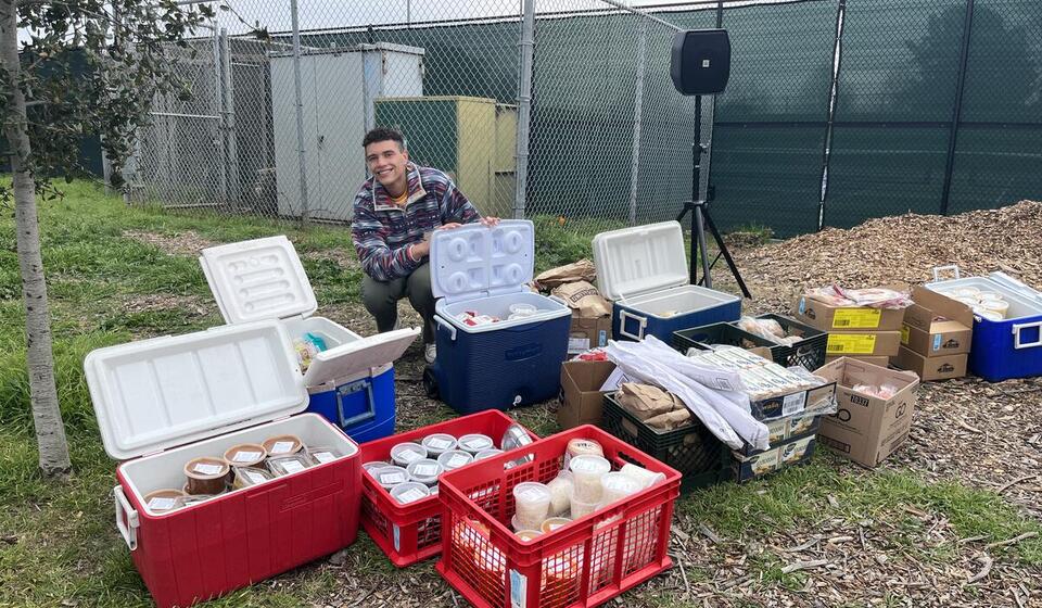 Food collection bins on a grassy field